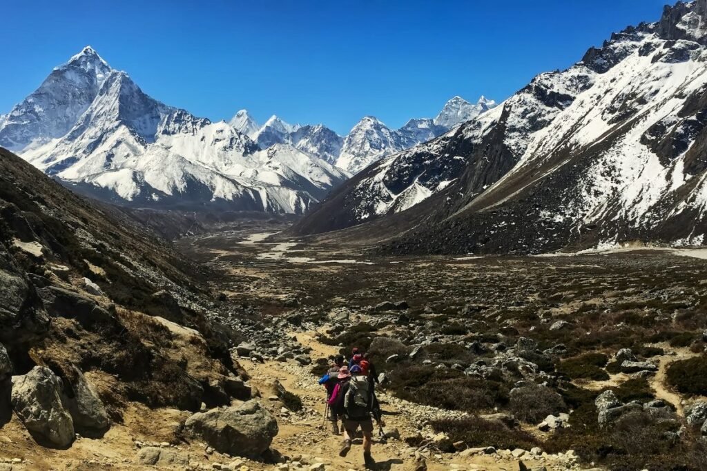 group of trekkers on a trail to Everest Base Camp.