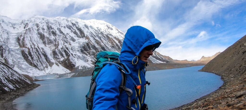 Tilicho Lake - A man taking a sefie at the shore of Tilicho lake in Himalayas
