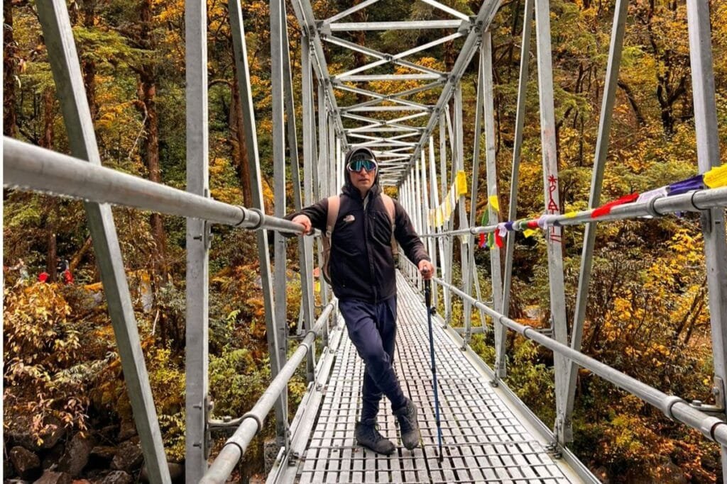 trekkers in suspension bridge 