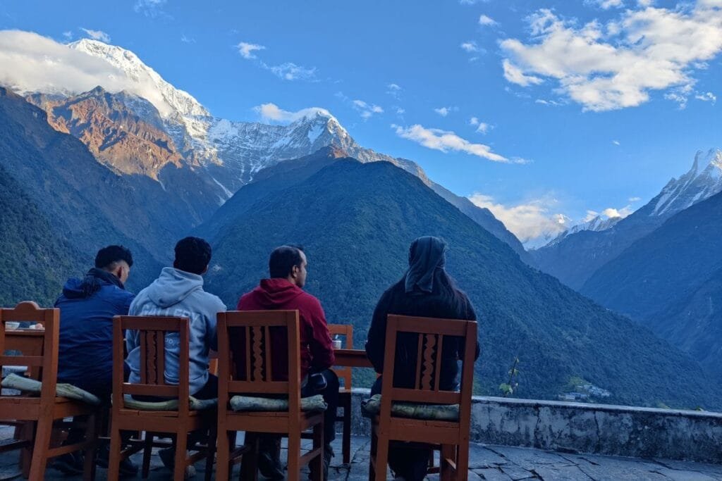 Trekkers are resting in tea house on the way to ABC trek