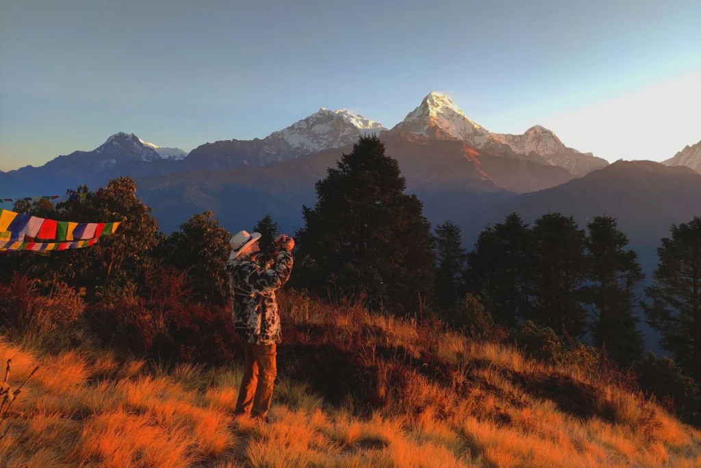 Men taking photo of sunsetting in Poon Hill