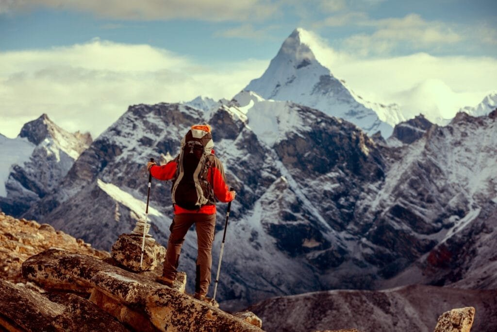 Hiker posing at camera on the trek in Himalayas, Nepal