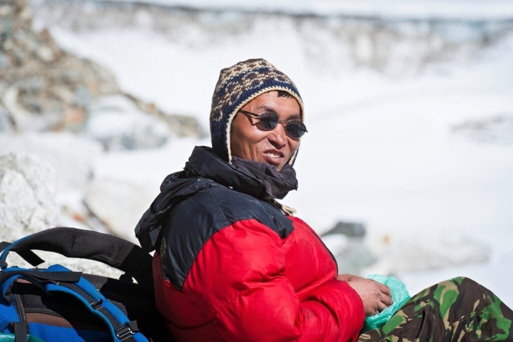 Sherpa guide smiling Himalayas Nepal